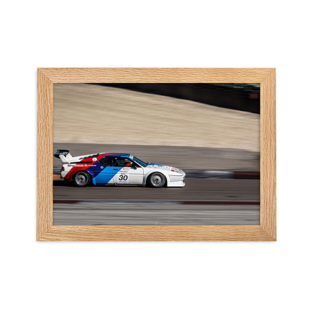 Photographie en action 'BMW M1' par Charles Coley, où la voiture de course iconique est capturée à pleine vitesse, fusionnant passion pour la course et maîtrise photographique dans une image vibrante et énergique.